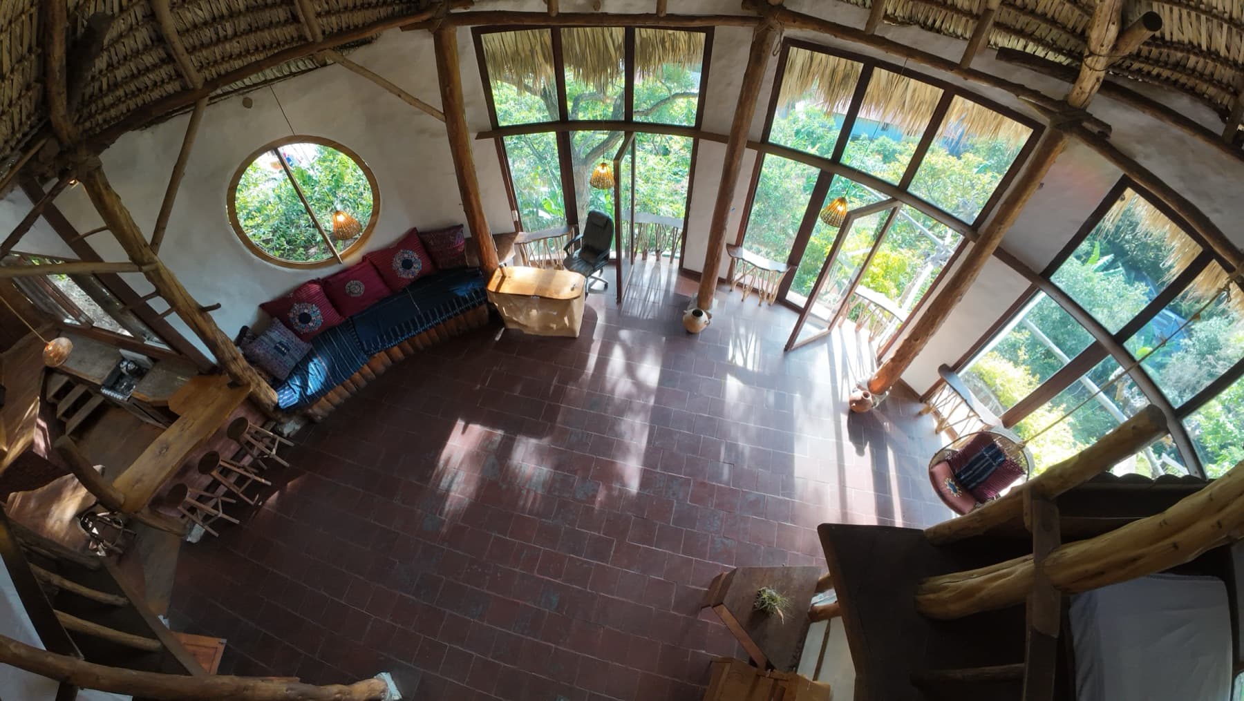 Overhead view of El Taller's open floor, framed by floor-to-ceiling windows